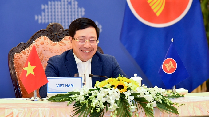 越南政府副总理兼外交部长范平明以视频形式出席会议